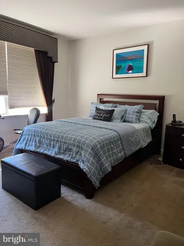 a bath tub sitting next to a white sink