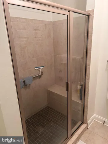a bathroom with a sink vanity and mirror