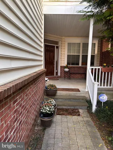 a outdoor space with patio furniture and potted plants