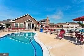 a dining table with chairs and window