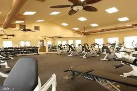 a living room with fireplace furniture and a large window