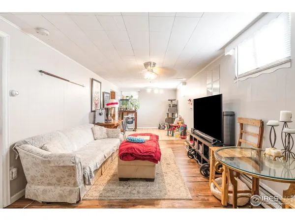 a living room with furniture and a table