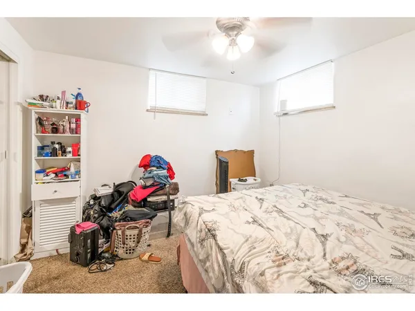 a utility room with a sink and a mirror