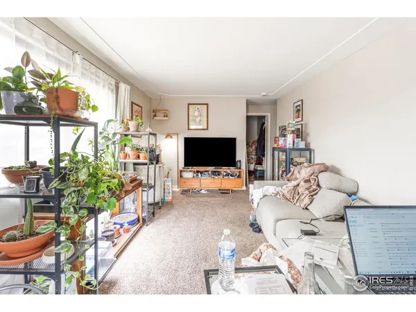 a bedroom with a bed and a table in it