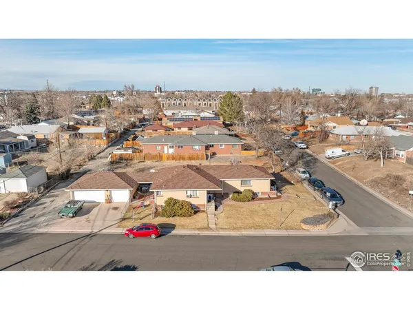 an aerial view of residential building and parking space
