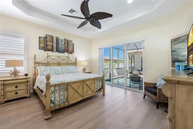 a spacious bedroom with a bed and a table in it