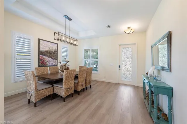 a view of a livingroom with furniture window and wooden floor