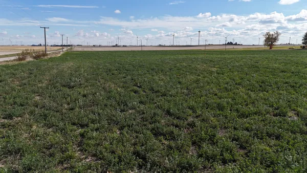 a view of yard with swimming pool and outdoor seating