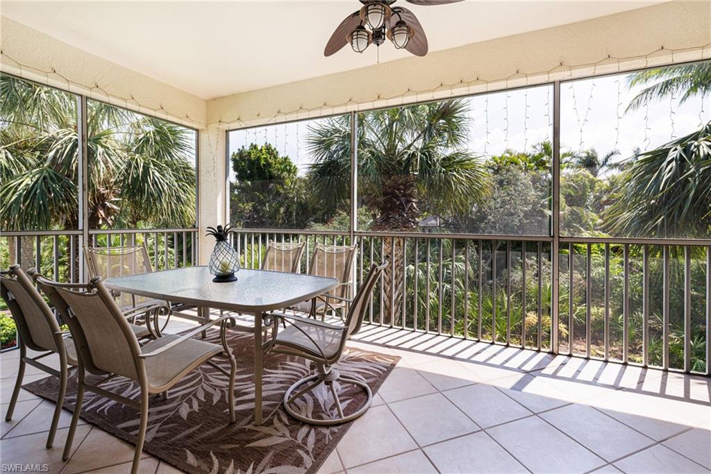 19081 Ridgepoint Drive, Unit 201 Estero, FL 33928 - Photo 1 of 50 a view of a patio with a yard chairs and a table