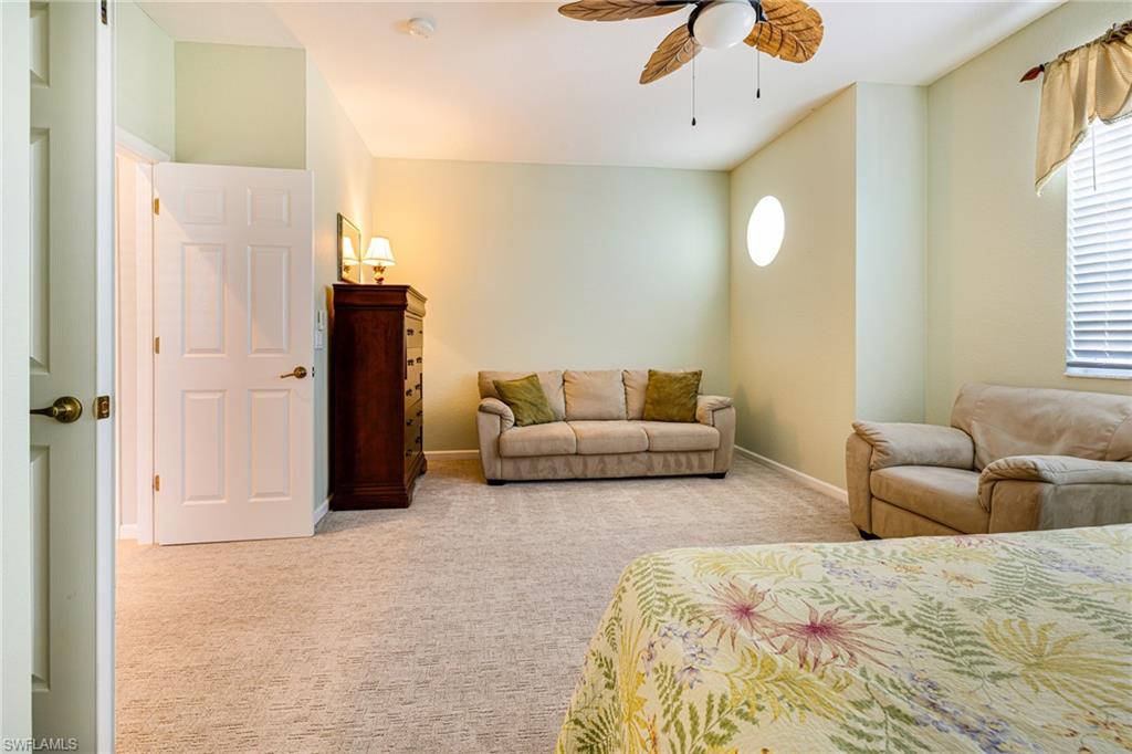 19081 Ridgepoint Drive, Unit 201 Estero, FL 33928 - Photo 22 of 50 a living room with couches and painted walls