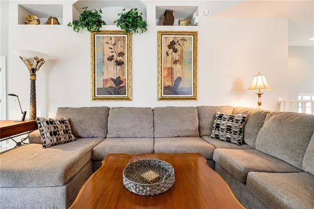 a living room with furniture and a couch