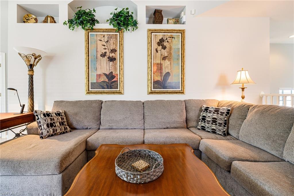 19081 Ridgepoint Drive, Unit 201 Estero, FL 33928 - Photo 4 of 50 a living room with furniture and a couch