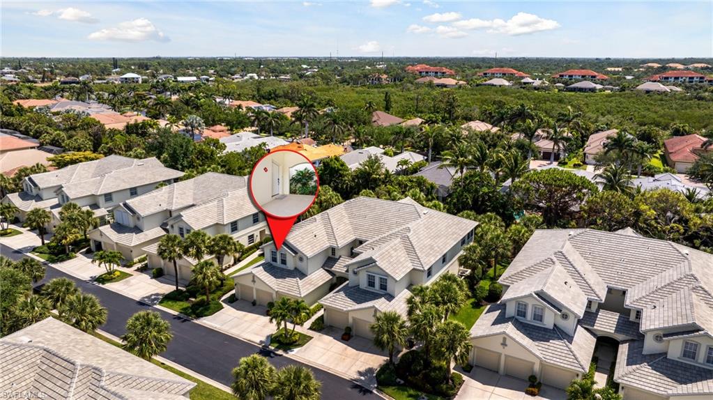 19081 Ridgepoint Drive, Unit 201 Estero, FL 33928 - Photo 41 of 50 an aerial view of a houses with a swimming pool