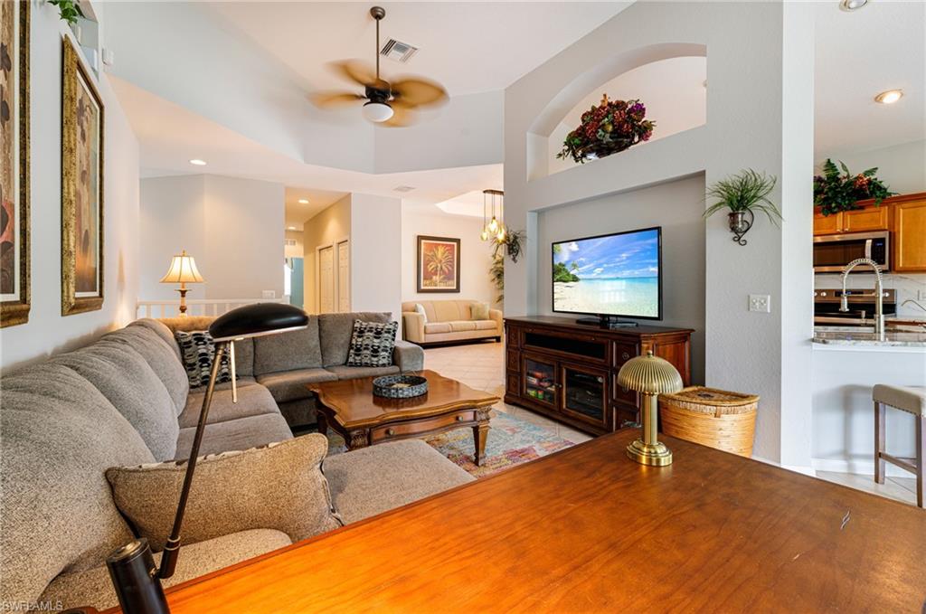 19081 Ridgepoint Drive, Unit 201 Estero, FL 33928 - Photo 6 of 50 a living room with furniture and a flat screen tv