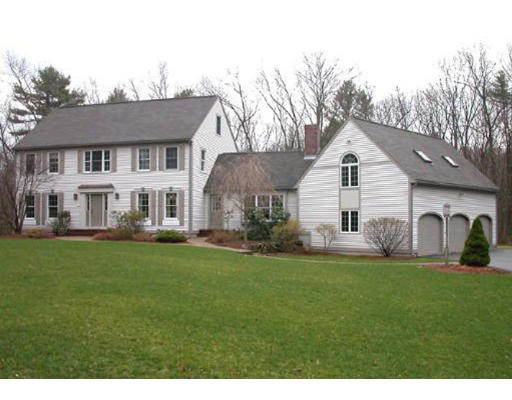 31 B Hunters Road Boxford, MA 01921 - Photo 1 of 11 a front view of a house with a yard and garage