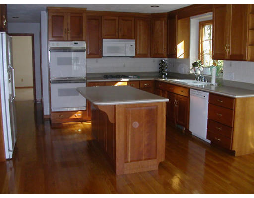 31 B Hunters Road Boxford, MA 01921 - Photo 4 of 11 a kitchen with stainless steel appliances granite countertop a refrigerator a stove and a sink