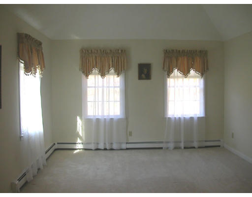 31 B Hunters Road Boxford, MA 01921 - Photo 7 of 11 an empty room with windows