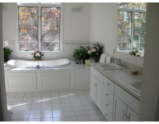 31 B Hunters Road Boxford, MA 01921 - Photo 8 of 11 a bathroom with a sink and a mirror