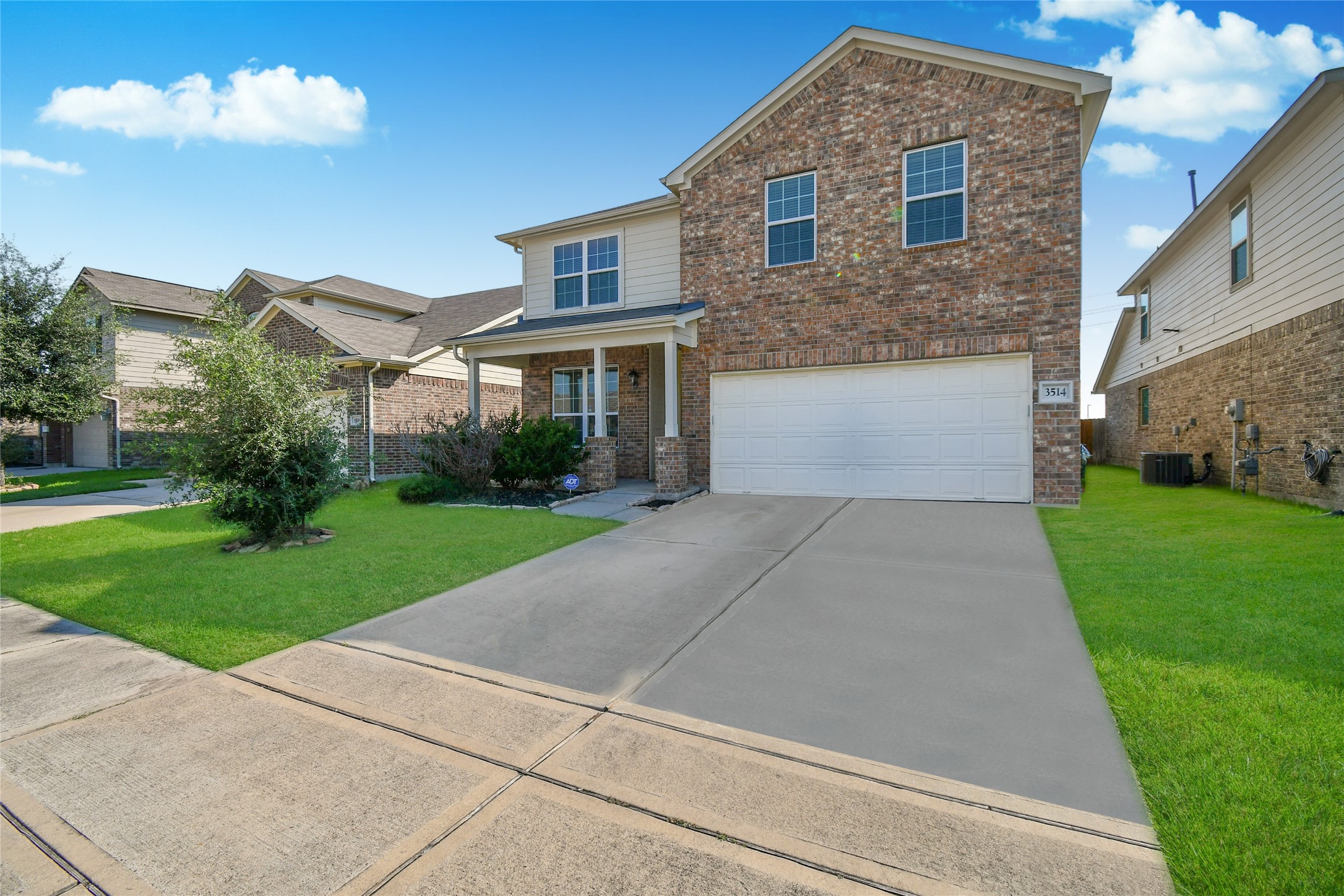 3514 Marquesa Lane Houston, TX 77084 - Photo 2 of 7 a front view of a house with a yard and garage