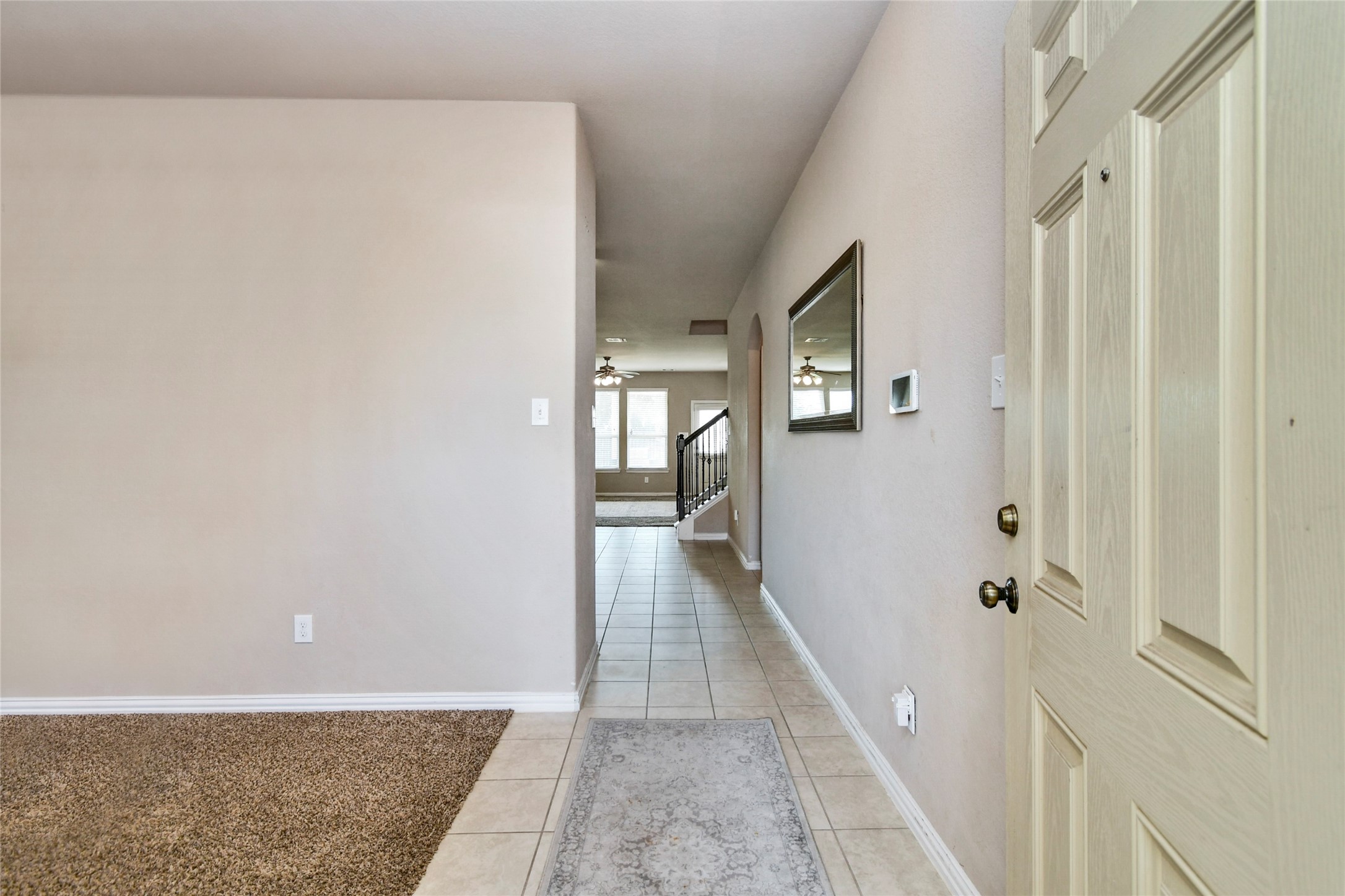 3514 Marquesa Lane Houston, TX 77084 - Photo 4 of 7 a view of a hallway with wooden floor and staircase
