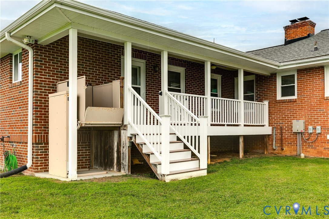12365 Ashcake Road Ashland, VA 23005 - Photo 71 of 80 Brick exterior featuring a covered porch with whit