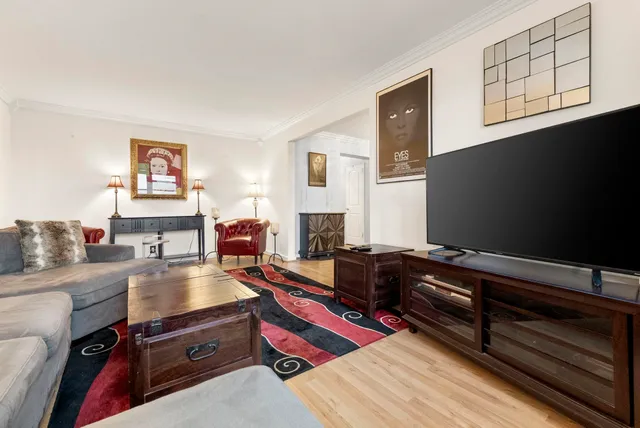 a living room with furniture fireplace and flat screen tv