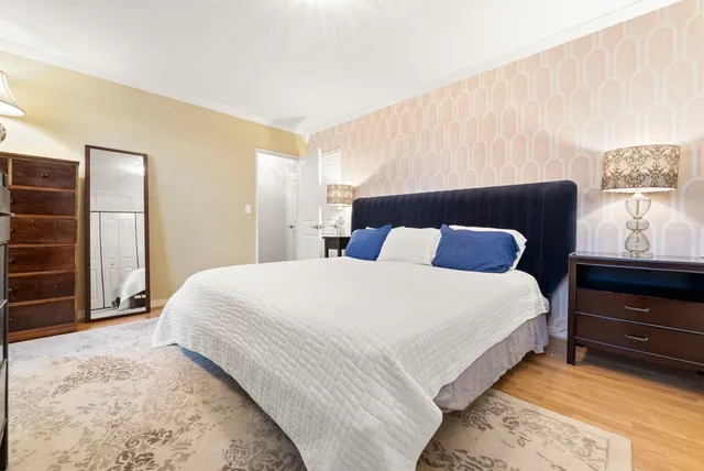 a bedroom with a bed and window