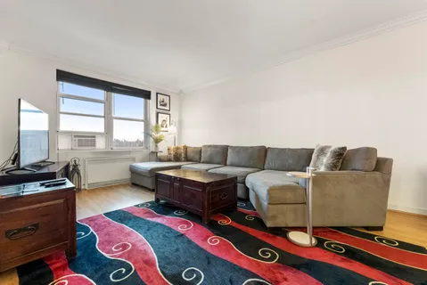 a living room with furniture and a window