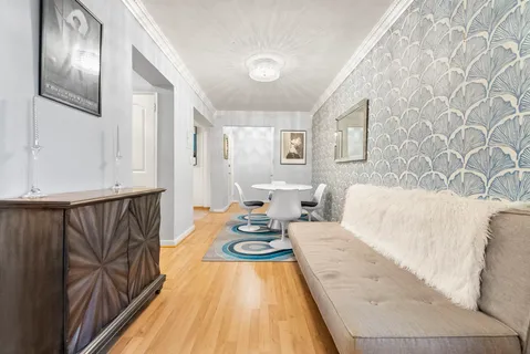 a bedroom with furniture and a wooden floor