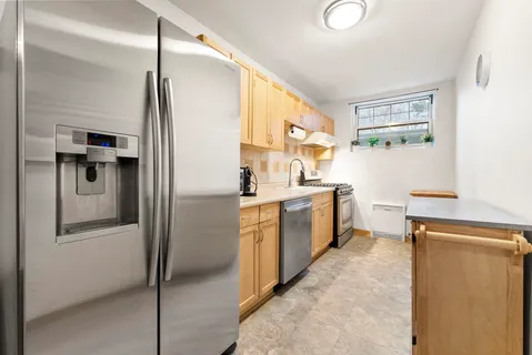 a kitchen with a refrigerator a sink and dishwasher