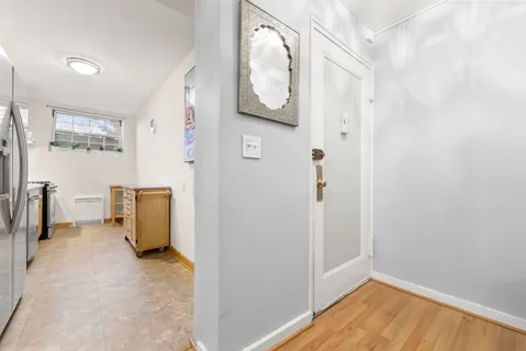 a view of a storage & utility room with a window