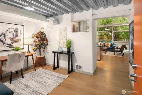 a living room with furniture and a table