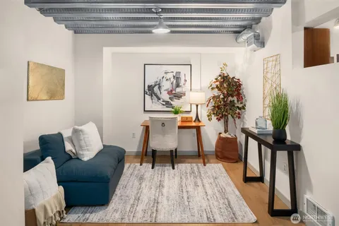 a workspace with furniture and wooden floor