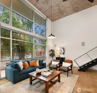 a living room with furniture and a window