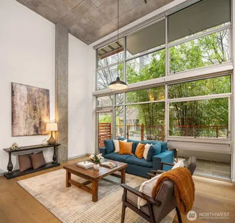 a living room with furniture and a large window