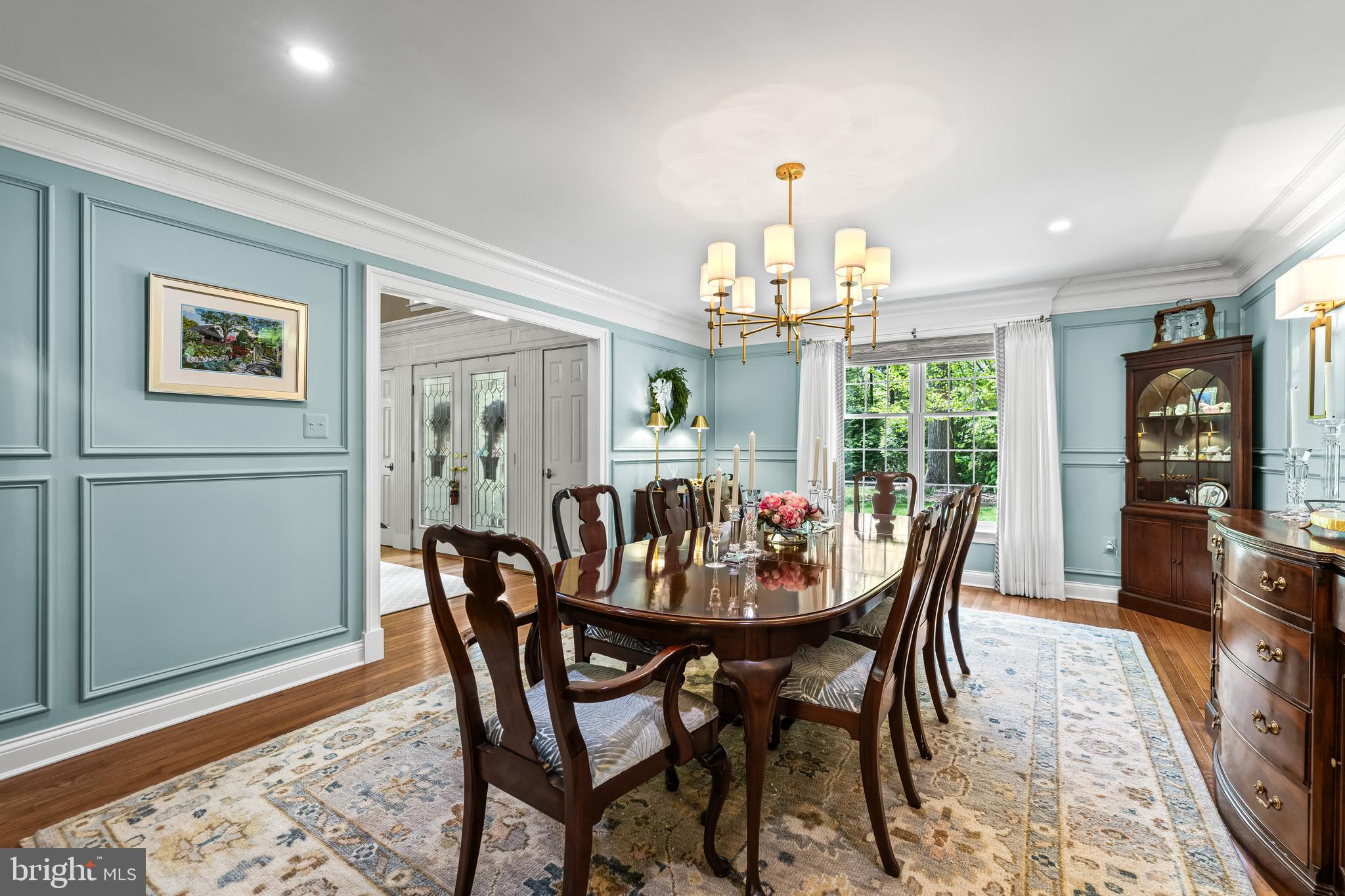 2428 Old Bosley Road Cockeysville, MD 21030 - Photo 11 of 53 a dining room with furniture a chandelier and wooden floor
