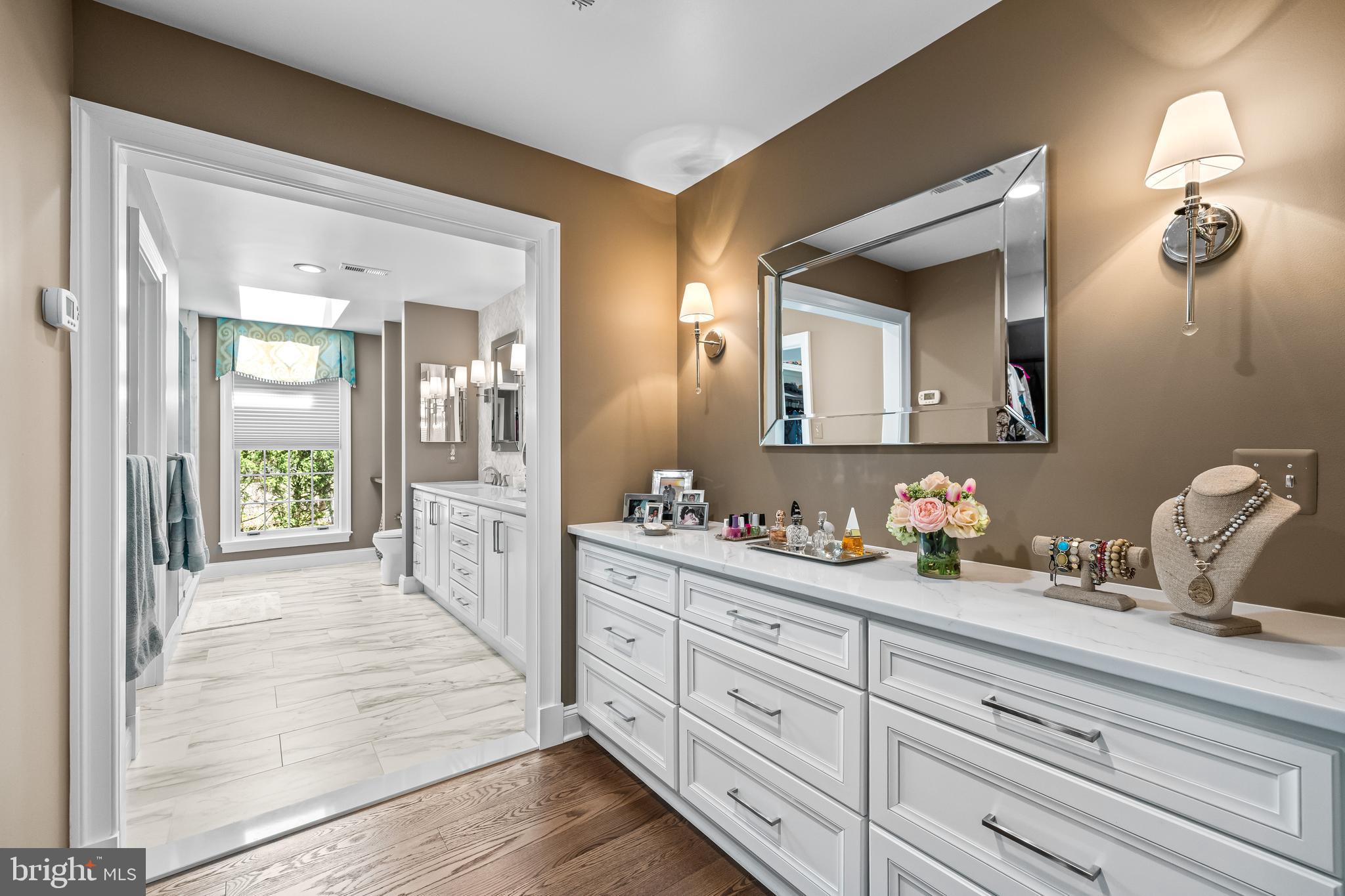 2428 Old Bosley Road Cockeysville, MD 21030 - Photo 30 of 53 a spacious bathroom with a double vanity sink and a mirror