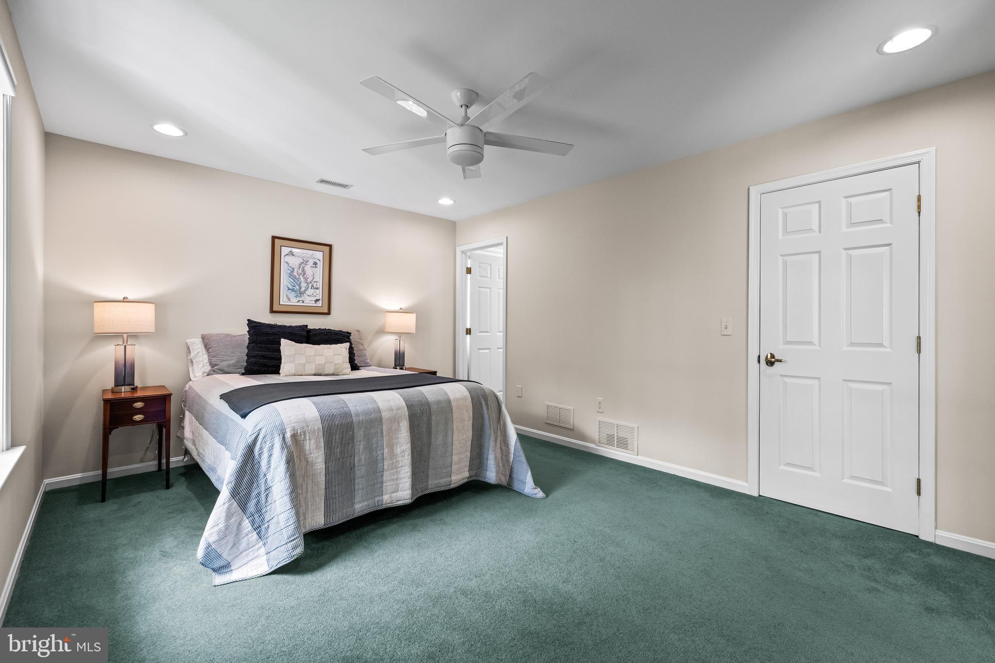 2428 Old Bosley Road Cockeysville, MD 21030 - Photo 35 of 53 a bedroom with a bed and a chandelier