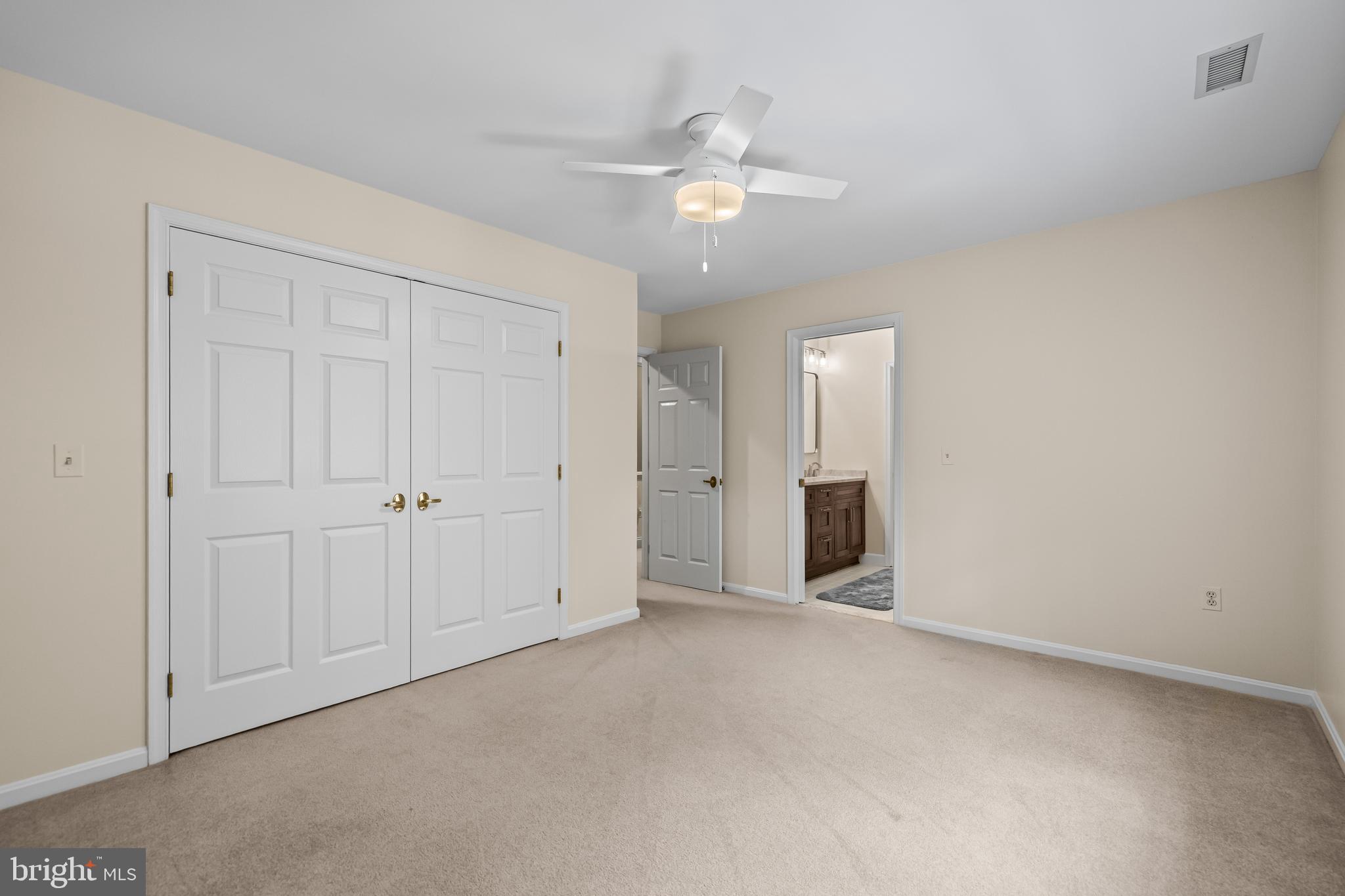 2428 Old Bosley Road Cockeysville, MD 21030 - Photo 37 of 53 a view of an empty room with a ceiling fan