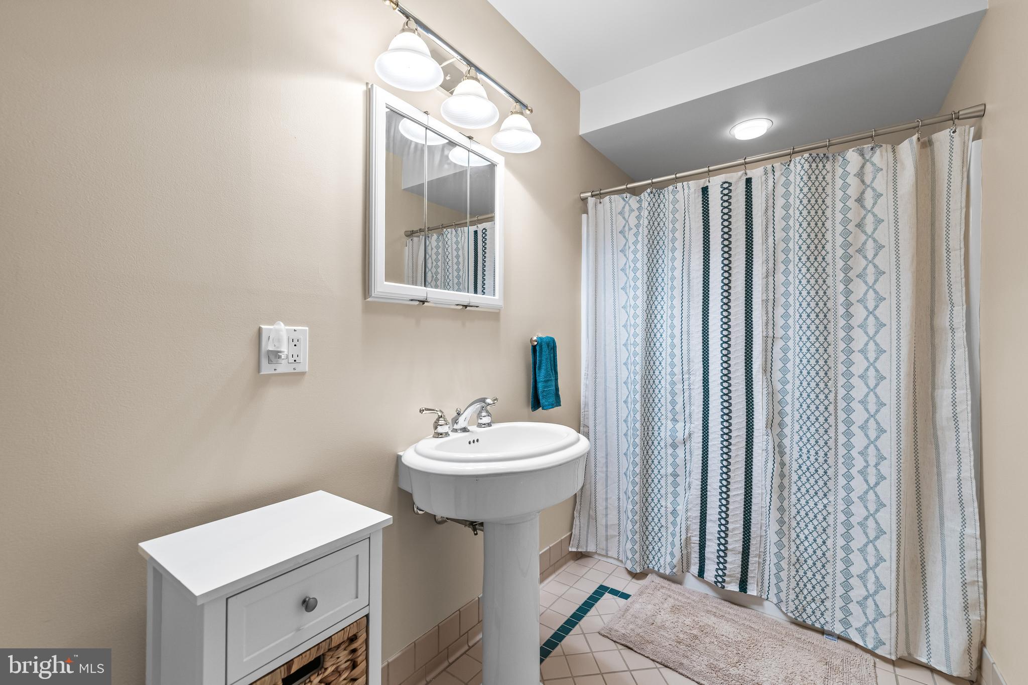 2428 Old Bosley Road Cockeysville, MD 21030 - Photo 46 of 53 a bathroom with a sink mirror and toilet
