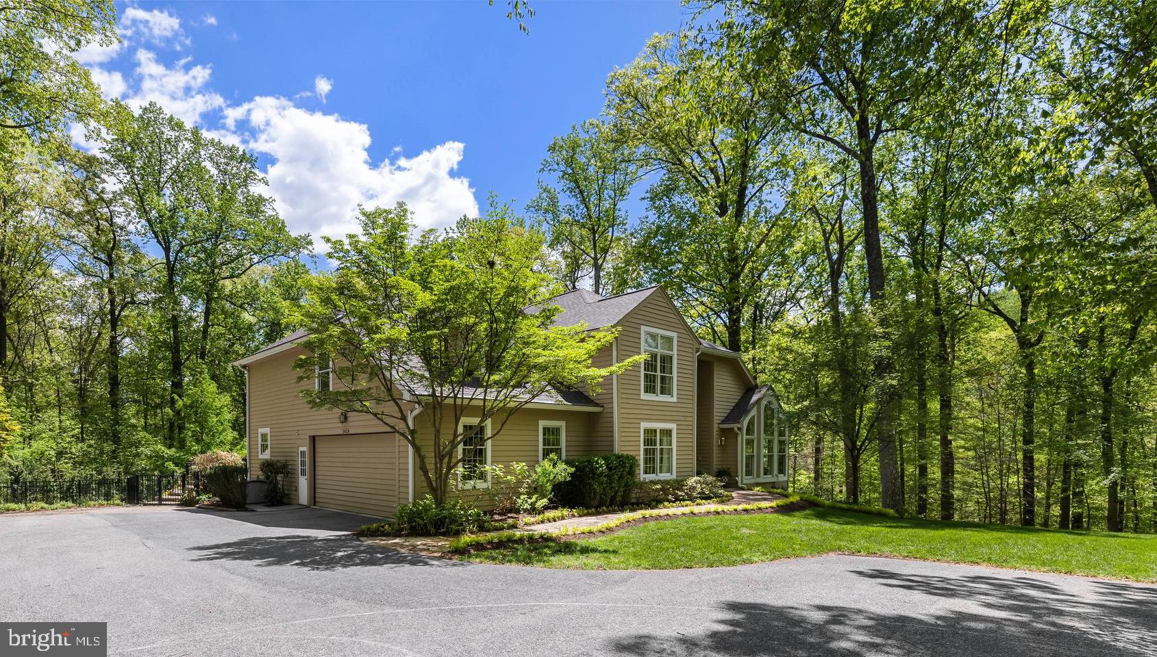 2428 Old Bosley Road Cockeysville, MD 21030 - Photo 51 of 53 a front view of a house with a yard and trees