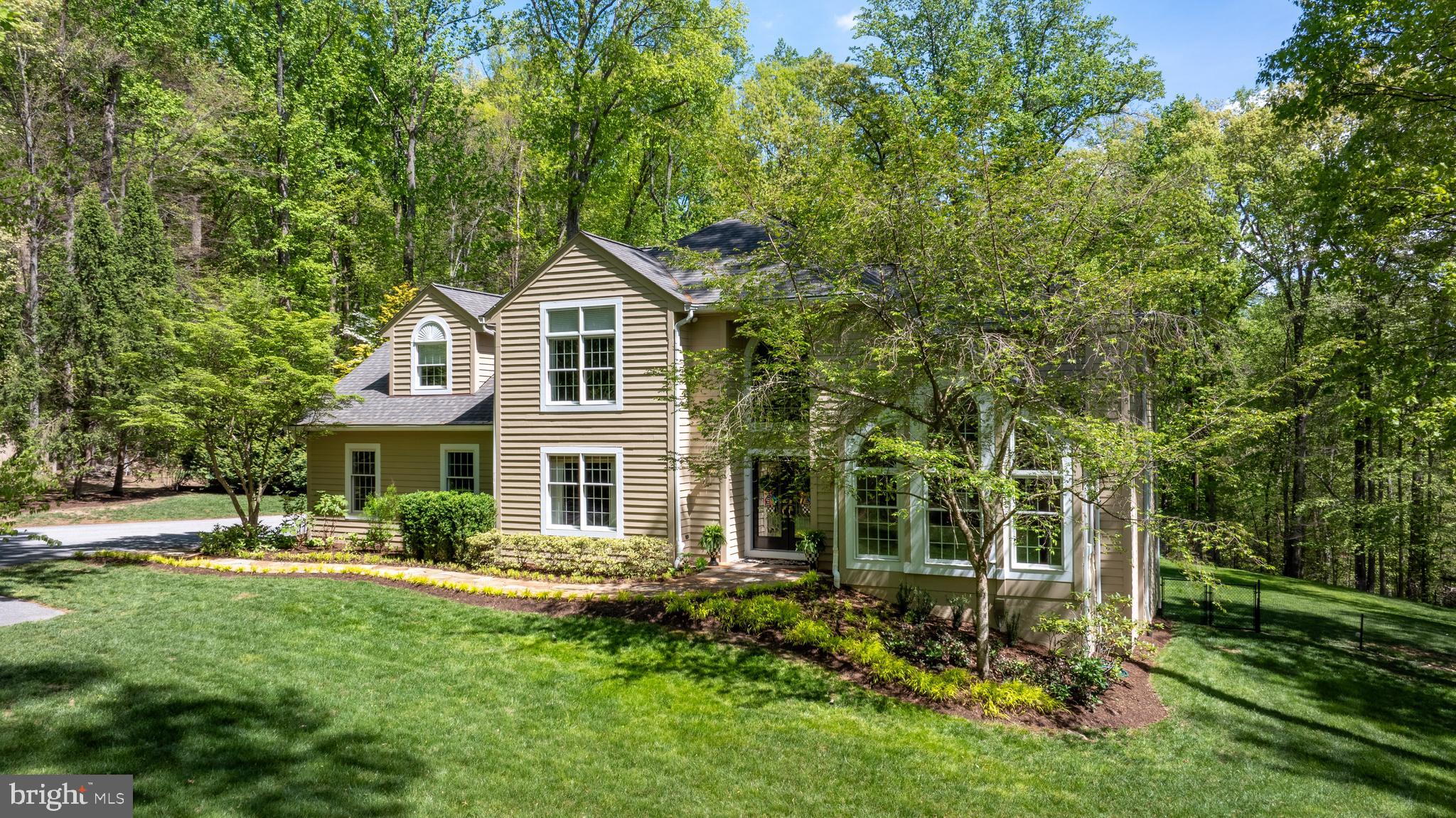 2428 Old Bosley Road Cockeysville, MD 21030 - Photo 52 of 53 a front view of a house with a yard