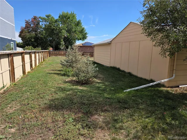 a view of a house with backyard porch and sitting area