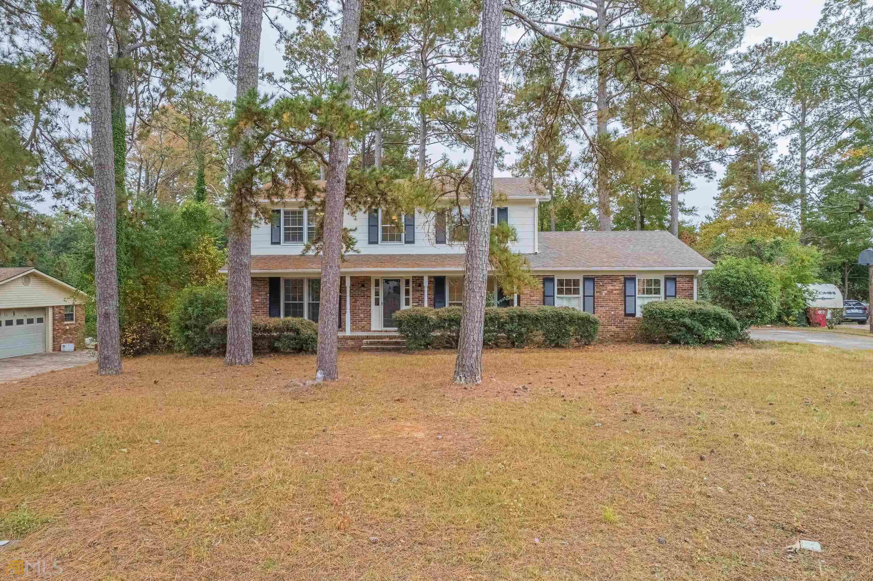 963 Hill Place Macon, GA 31210 - Photo 1 of 1 front view of a house with yard and trees
