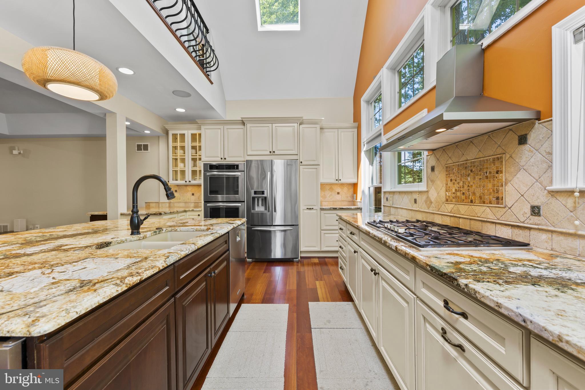 11019 Ring Road Reston, VA 20190 - Photo 20 of 78 a kitchen with stainless steel appliances granite countertop a stove a sink and a refrigerator