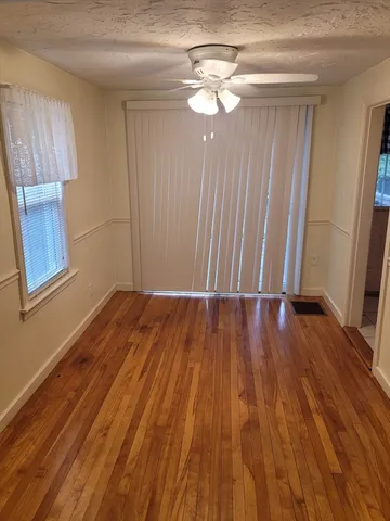 wooden floor with window in an empty room