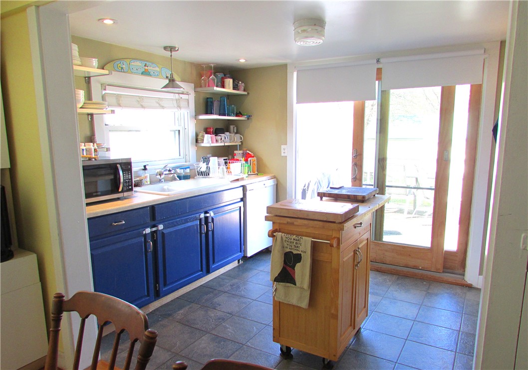 35 Rosa Road Middletown, RI 02842 - Photo 3 of 10 Open and sunny kitchen leading to deck.