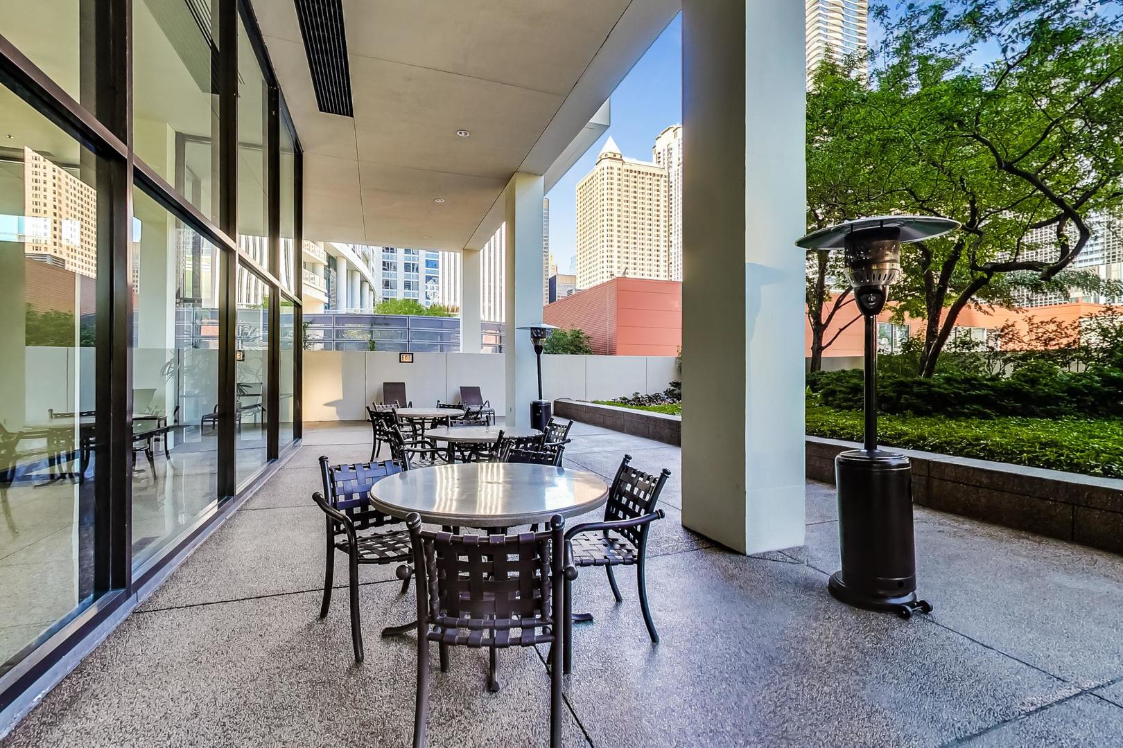 360 East Randolph Street, Unit 1007 Chicago, IL 60601 - Photo 24 of 28 a view of an outdoor dining space with furniture