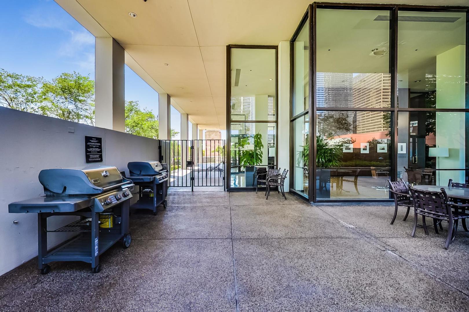 360 East Randolph Street, Unit 1007 Chicago, IL 60601 - Photo 25 of 28 a view of a workspace with furniture and a window