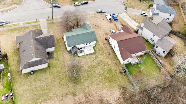an aerial view of residential houses with outdoor space